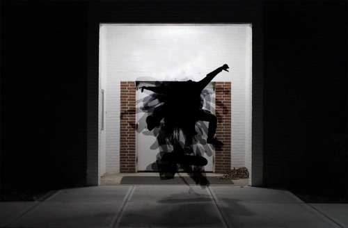 Silhouettes of skateboard tricks overlayed on each other