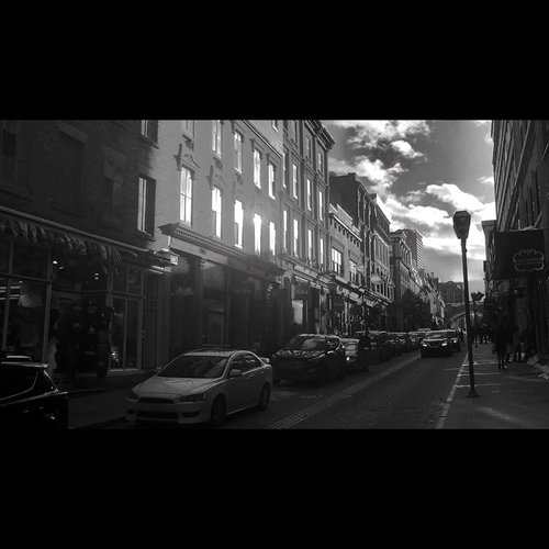 A cinematic black and white landscape of another Quebec city street