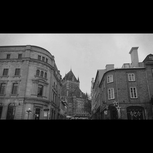 A cinematic black and white landscape of the Quebec City chateau