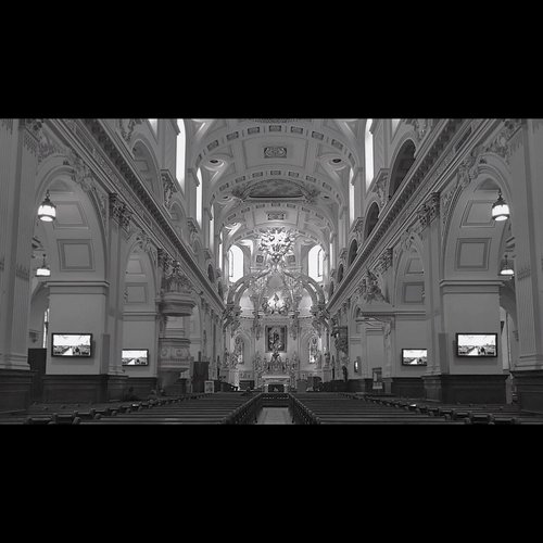 A cinematic black and white landscape of A cathedral interior in Quebec city